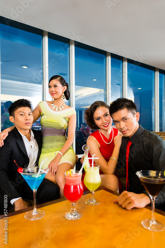 Photo: Chinese people drinking cocktails in luxury cocktail bar Chinese people drinking cocktails in luxury cocktail bar