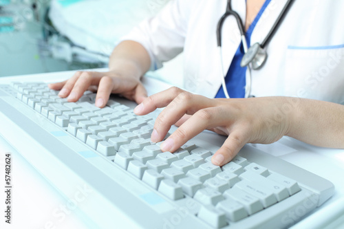 Photo: Female doctor working on the computer Female doctor working on the computer
