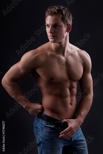 Photo: Muscle sexy naked young man posing in jeans Muscle sexy naked young man posing in jeans
