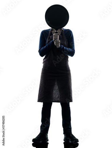 Photo: woman cooking hiding behind frying pan silhouette woman cooking hiding behind frying pan silhouette
