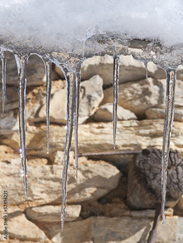 Photo: icicles on stone wall icicles on stone wall