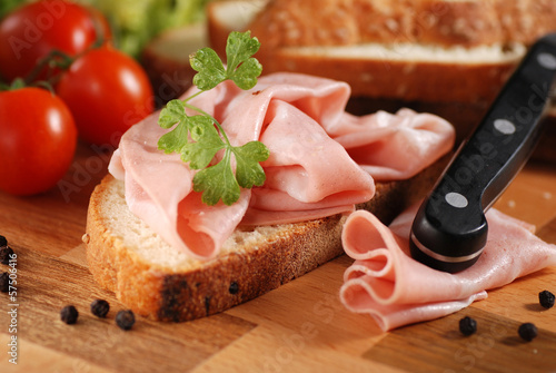 Photo: mortadella sulla fetta di pane casereccio mortadella sulla fetta di pane casereccio