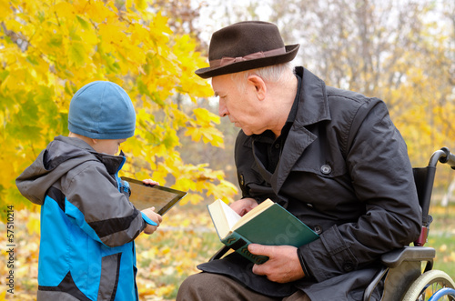 Photo: Generation gap between grandchild and grandfather Generation gap between grandchild and grandfather