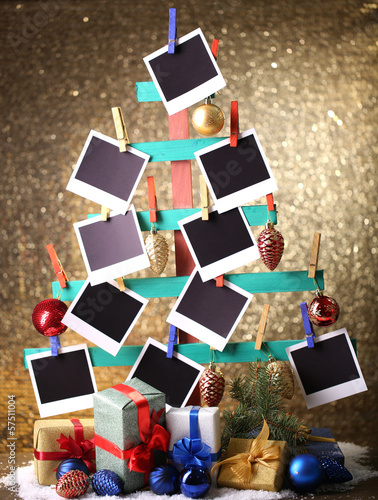 Photo: Wooden hand made fir tree with empty photo paper and Christmas Wooden hand made fir tree with empty photo paper and Christmas