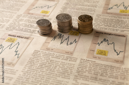 Photo: Newspaper stock market with money Newspaper stock market with money
