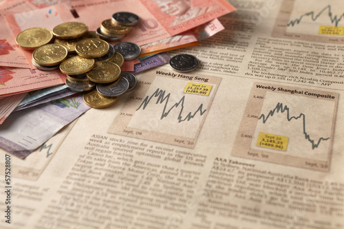 Photo: Newspaper stock market with money Newspaper stock market with money