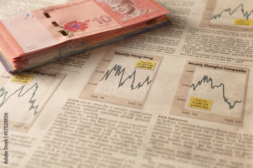 Photo: Newspaper stock market with money Newspaper stock market with money