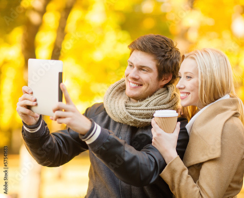 Photo: couple taking photo picture autumn park couple taking photo picture autumn park