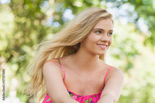 Photo: Beautiful casual woman sitting on a lawn Beautiful casual woman sitting on a lawn