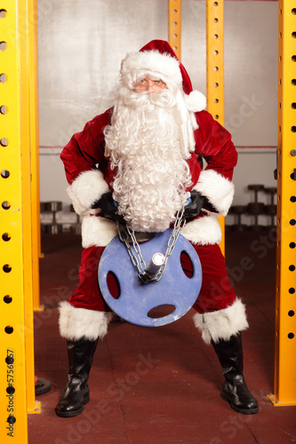 Photo: Santa Claus n training before Christams time in gym Santa Claus n training before Christams time in gym