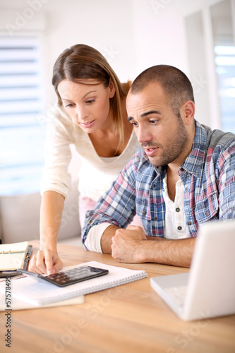 Photo: Couple being worried about their budget Couple being worried about their budget