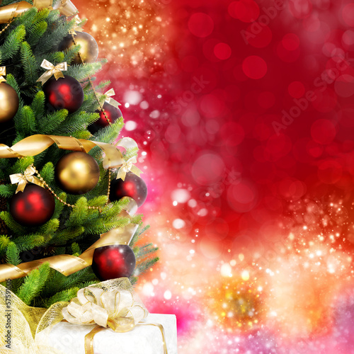 Photo: Wonderfully decorated Christmas Tree with balls, ribbons and gar Wonderfully decorated Christmas Tree with balls, ribbons and gar