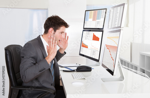 Photo: Businessman Working At Office Businessman Working At Office