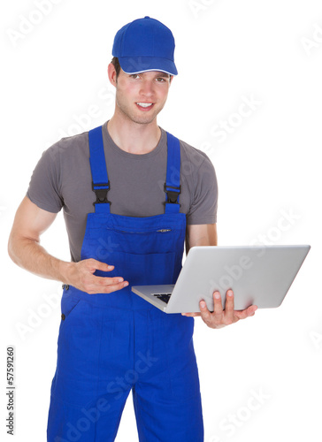 Photo: Mechanic Holding Laptop Mechanic Holding Laptop