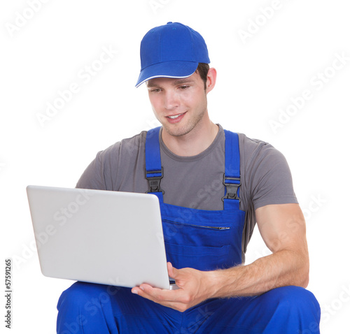 Photo: Mechanic Holding Laptop Mechanic Holding Laptop
