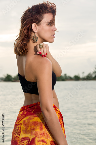 Photo: Profile of woman in the beach Profile of woman in the beach