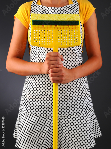 Photo: Woman Holding a Mop Woman Holding a Mop
