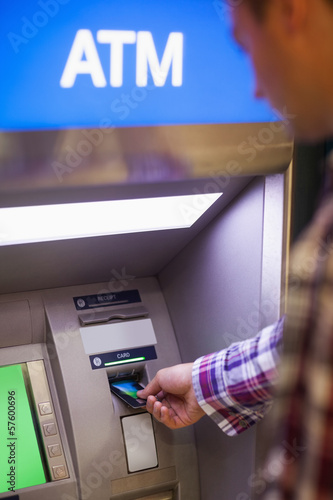 Photo: Casual student withdrawing cash Casual student withdrawing cash