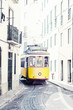 yellow ancient tram on streets of Lisbon, Portugal yellow ancient tram on streets of Lisbon, Portugal