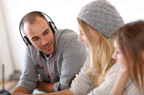 Photo: Friends having great time listening to music Friends having great time listening to music