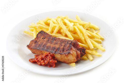 Photo: Grilled pork meat and french fries Grilled pork meat and french fries