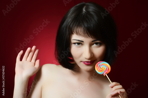 Photo: The girl with a sugar candy The girl with a sugar candy