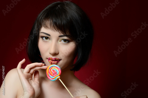 Photo: The girl with a sugar candy The girl with a sugar candy