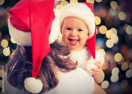 Photo: Christmas magic happy family mother and baby Christmas magic happy family mother and baby