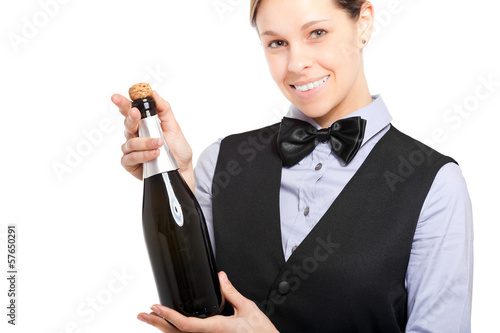 Photo: Waitress holding a bottle of champagne isolated on white Waitress holding a bottle of champagne isolated on white