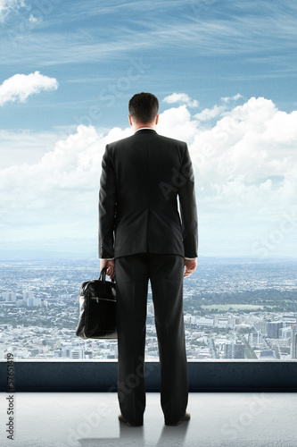 Photo: businessman looking to city businessman looking to city