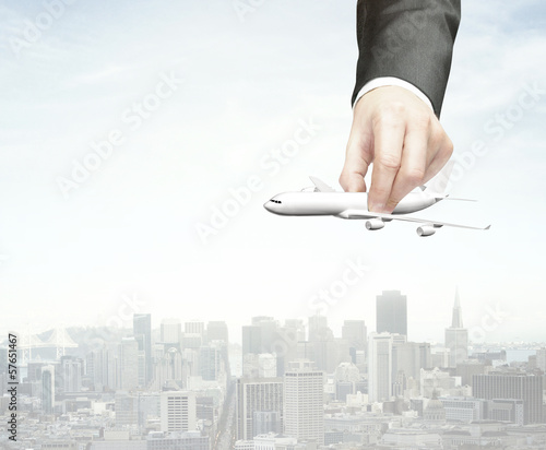 Photo: hand holding plane hand holding plane