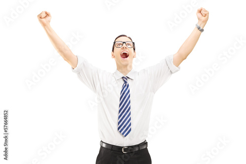 Photo: Excited male with raised hands gesturing happiness Excited male with raised hands gesturing happiness