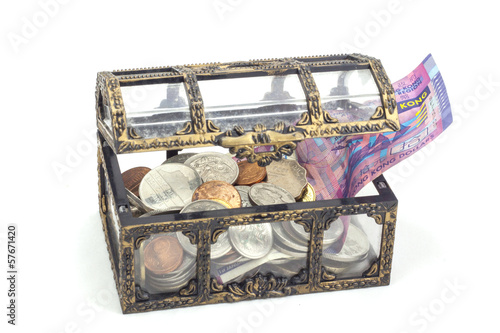Photo: Coins and bank note in the coffer Coins and bank note in the coffer