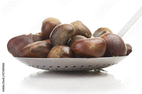 Photo: aluminium skimmer with chestnuts on the white aluminium skimmer with chestnuts on the white