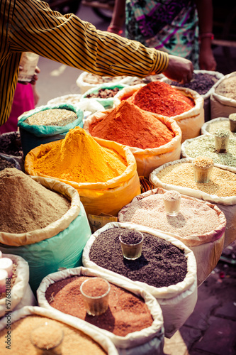 Fototapeta Traditional spices and dry fruits in local bazaar in India.