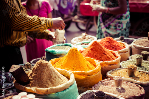 Fototapeta Traditional spices and dry fruits in local bazaar in India.