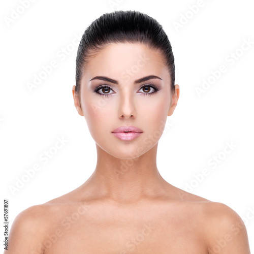 Photo: Beautiful face of young woman with clean skin Beautiful face of young woman with clean skin