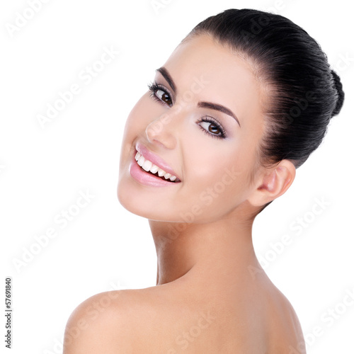 Photo: Beautiful face of young woman with clean skin Beautiful face of young woman with clean skin