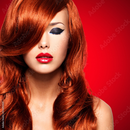 Photo: Portrait of a woman with long red hairs Portrait of a woman with long red hairs