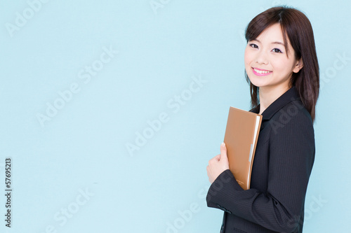 Photo: asian businesswoman on blue background asian businesswoman on blue background