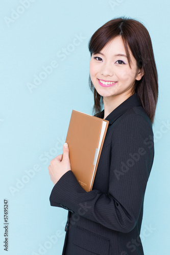 Photo: asian businesswoman on blue background asian businesswoman on blue background