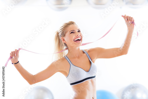 Photo: Woman with measuring tape Woman with measuring tape
