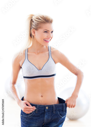Photo: Woman wearing pants that are too big Woman wearing pants that are too big
