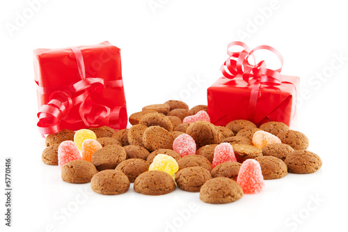 Photo: Typical dutch sweets: pepernoten (ginger nuts) and red presents Typical dutch sweets: pepernoten (ginger nuts) and red presents