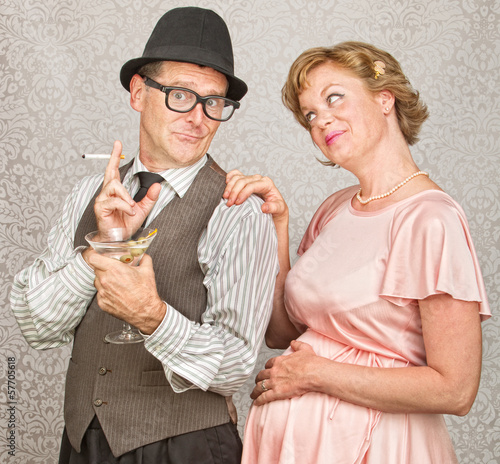 Photo: Concerned Woman with Smoking Man Concerned Woman with Smoking Man