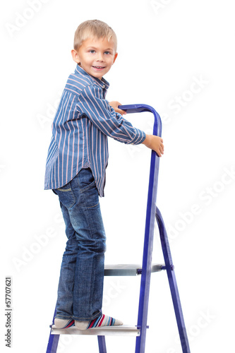 Photo: Boy is standing on ladder Boy is standing on ladder