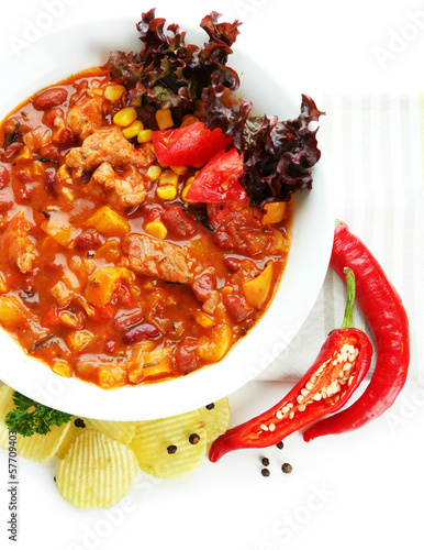 Photo: Chili Corn Carne - traditional mexican food, isolated on white Chili Corn Carne - traditional mexican food, isolated on white