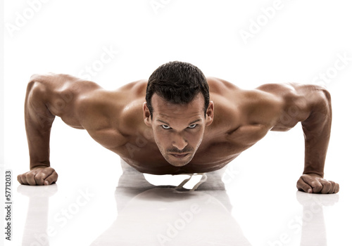 Photo: Muscle man in studio and showing the biceps muscle Muscle man in studio and showing the biceps muscle