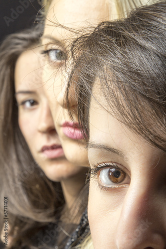 Photo: Three young beautiful girls close-up portrait color image Three young beautiful girls close-up portrait color image