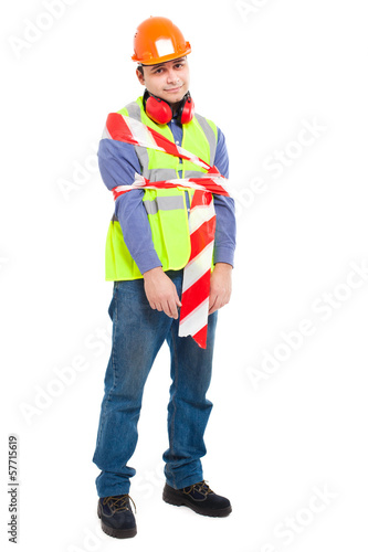 Photo: Worker wrapped in tape isolated on white Worker wrapped in tape isolated on white